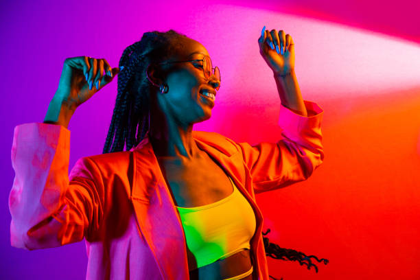 Beautiful afro-american woman with afro pigtails hairstyle and stylish clothes - Portrait of young black girl in studio